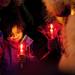 Six-year-old Ellie Rodgers looks at a candle in Kerrytown on Sunday. This was Ellie's first experience at the annual tree lighting event. Daniel Brenner I AnnArbor.com